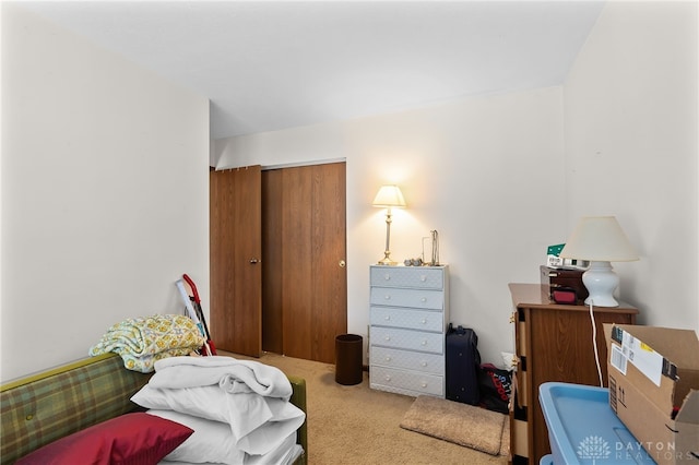 carpeted bedroom featuring a closet