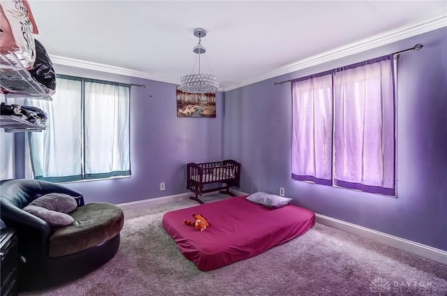 sitting room with an inviting chandelier, baseboards, crown molding, and carpet