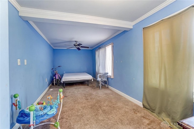 carpeted bedroom featuring ceiling fan, baseboards, and ornamental molding