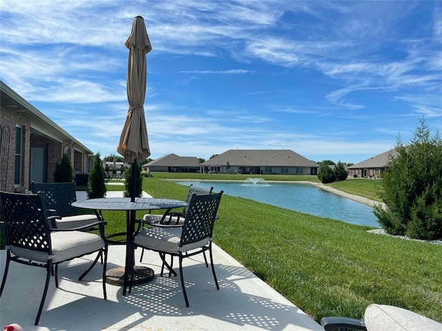 view of patio featuring a water view