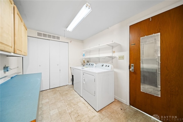 laundry area featuring cabinet space, visible vents, independent washer and dryer, and light floors