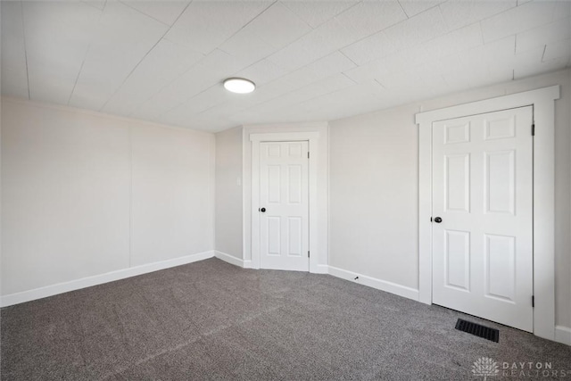 interior space featuring baseboards and visible vents