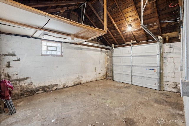 garage with concrete block wall