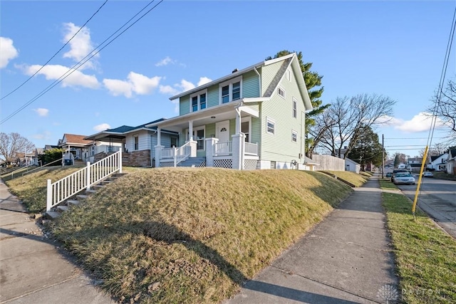 view of front of house featuring a residential view and a porch