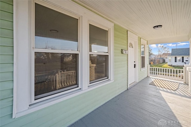 wooden terrace featuring a porch