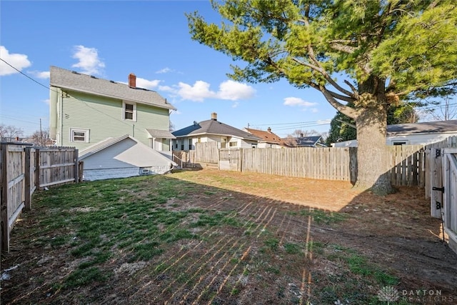 view of yard with a fenced backyard