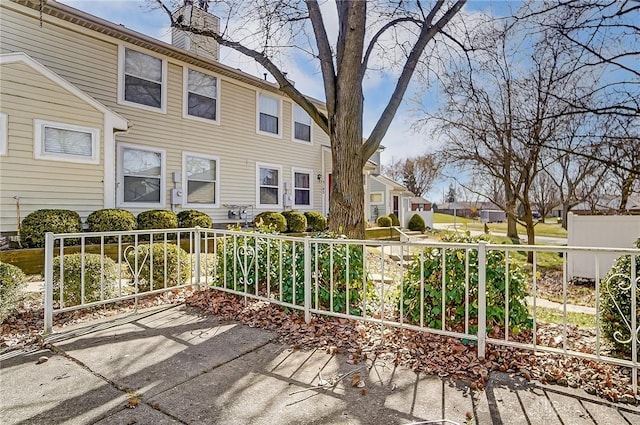 exterior space with fence and a residential view