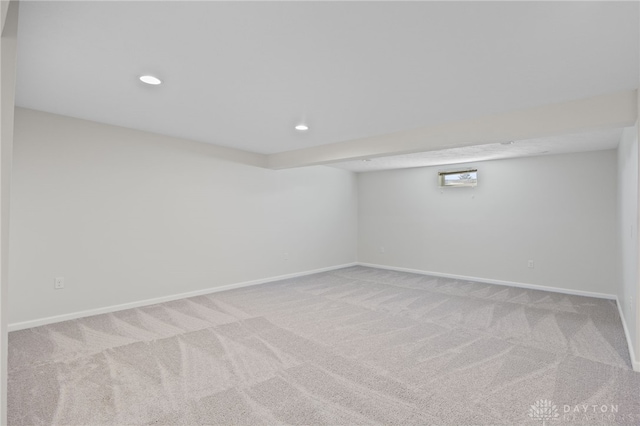 finished below grade area featuring carpet flooring, recessed lighting, and baseboards