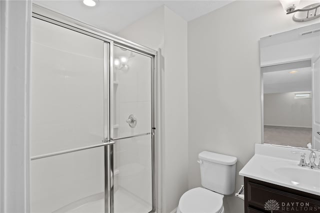 full bathroom featuring visible vents, a shower stall, toilet, and vanity