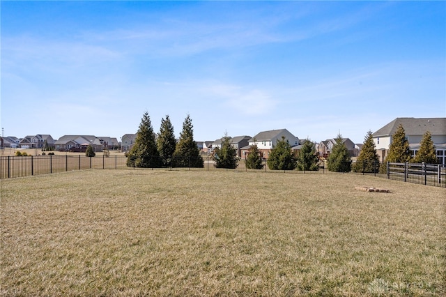 view of yard with fence and a residential view