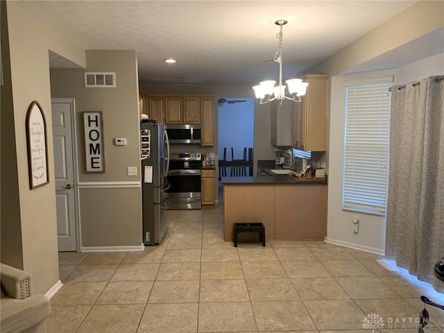 kitchen with visible vents, dark countertops, stainless steel appliances, light tile patterned floors, and a chandelier