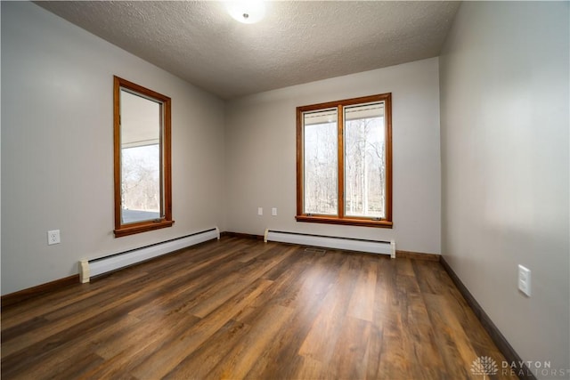 unfurnished room with baseboard heating, a textured ceiling, baseboards, and dark wood-style flooring