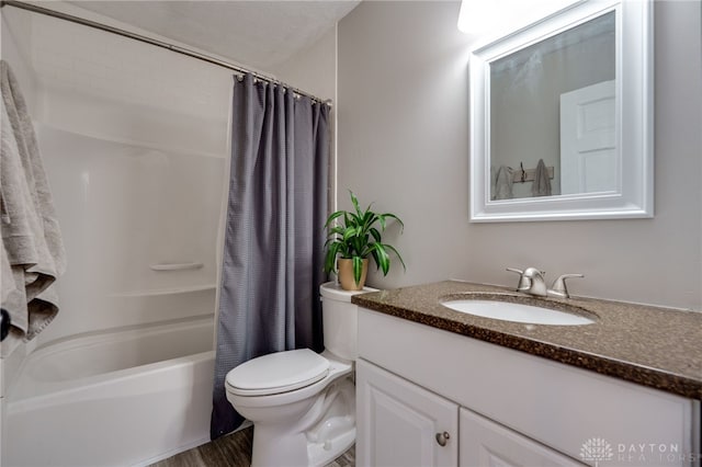 bathroom with toilet, shower / bath combo, and vanity