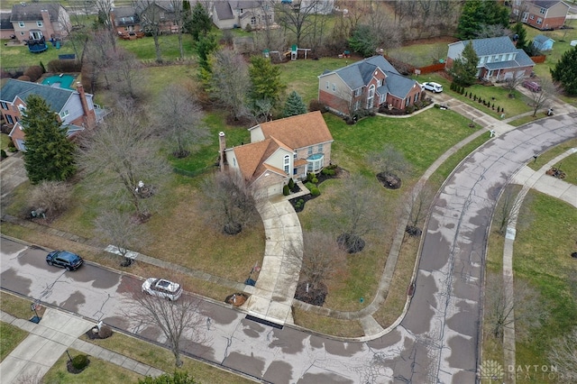 birds eye view of property with a residential view