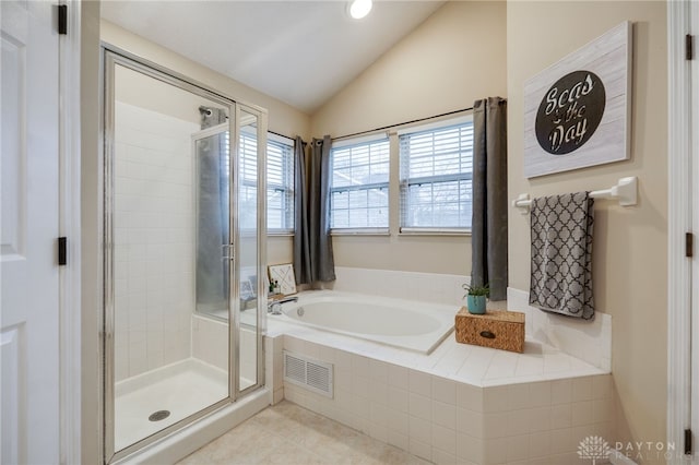 full bath with visible vents, a shower stall, tile patterned flooring, a bath, and vaulted ceiling