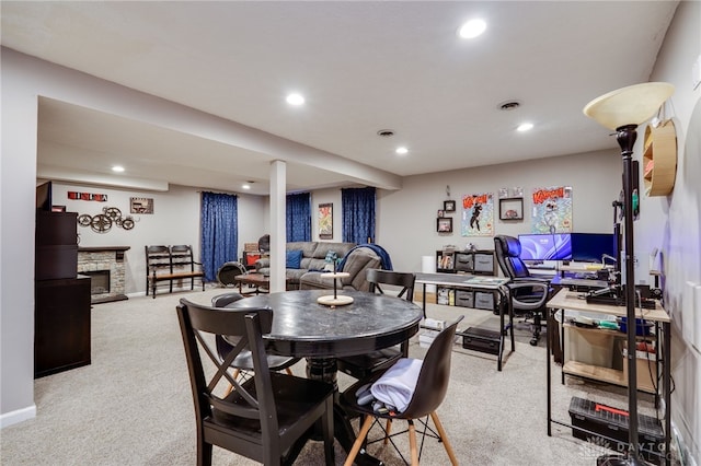 carpeted dining room with visible vents, recessed lighting, a fireplace, and baseboards