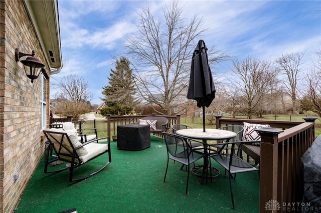 view of patio featuring a deck and outdoor dining space