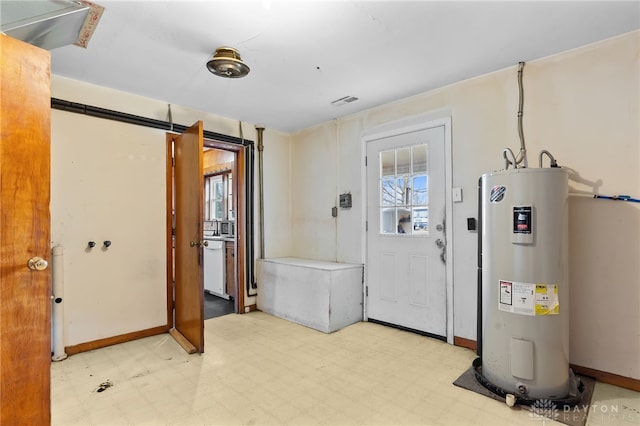6384 Heffner Rd, Tipp City, OH 45371 - entrance foyer with water heater, baseboards, and light floors