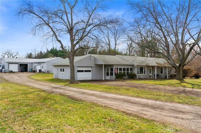 6384 Heffner Rd, Tipp City, OH 45371 - ranch-style home featuring a garage, driveway, and a front yard