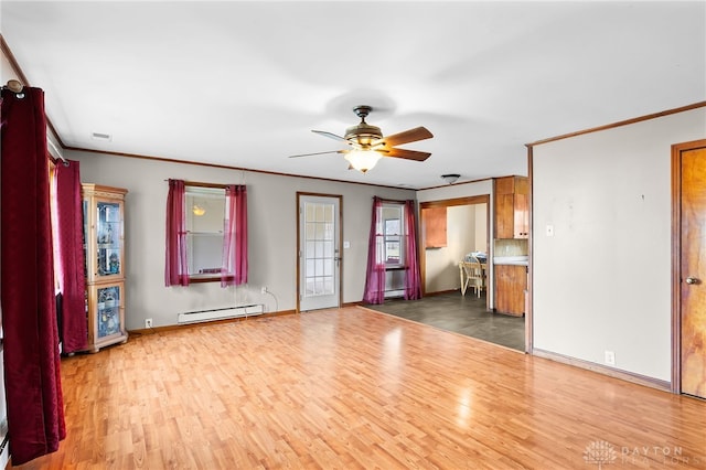 6384 Heffner Rd, Tipp City, OH 45371 - unfurnished living room featuring a baseboard radiator, baseboards, wood finished floors, and ceiling fan