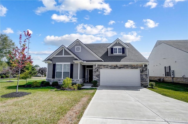 1002 Belfast Dr, Sugarcreek Township, OH 45440 - craftsman inspired home featuring a garage, stone siding, concrete driveway, and a front lawn