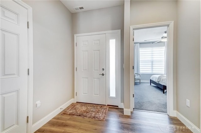 1002 Belfast Dr, Sugarcreek Township, OH 45440 - foyer featuring visible vents, baseboards, and wood finished floors