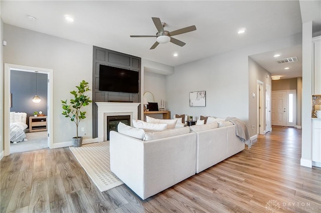 1002 Belfast Dr, Sugarcreek Township, OH 45440 - living area with visible vents, recessed lighting, light wood finished floors, baseboards, and ceiling fan