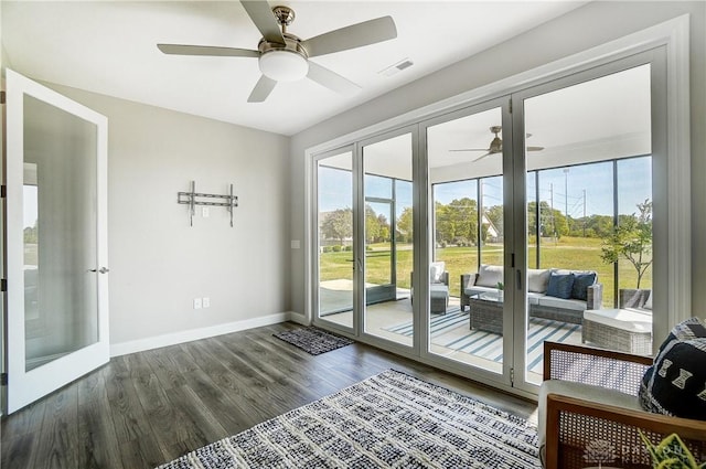 1002 Belfast Dr, Sugarcreek Township, OH 45440 - doorway featuring dark wood finished floors, visible vents, baseboards, and a ceiling fan