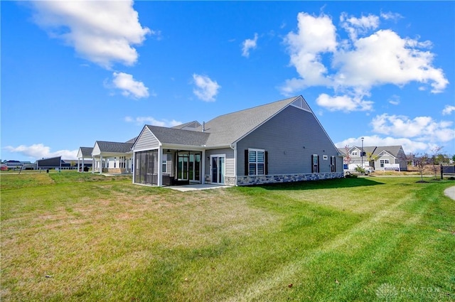 1002 Belfast Dr, Sugarcreek Township, OH 45440 - back of house with a yard and a sunroom