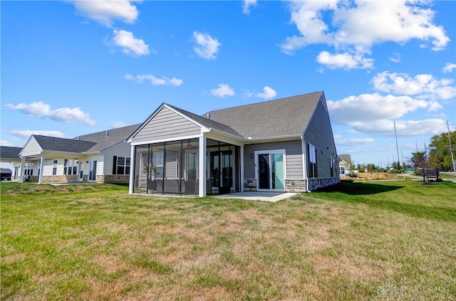 1002 Belfast Dr, Sugarcreek Township, OH 45440 - rear view of property with stone siding, a lawn, and a sunroom