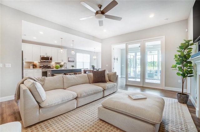 1002 Belfast Dr, Sugarcreek Township, OH 45440 - living room with recessed lighting, baseboards, light wood-type flooring, and a ceiling fan