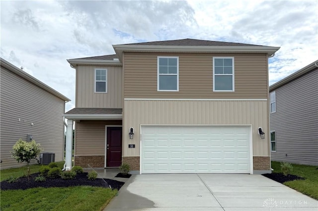 50 E Kentucky Ave, Wilmington, OH 45177 - view of front of property featuring driveway, a garage, and a shingled roof