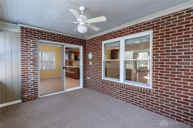 unfurnished sunroom with elevator, wooden ceiling, and a ceiling fan