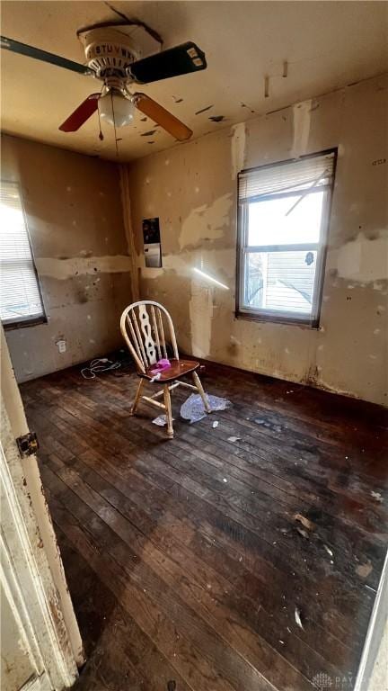 interior space featuring wood-type flooring and ceiling fan