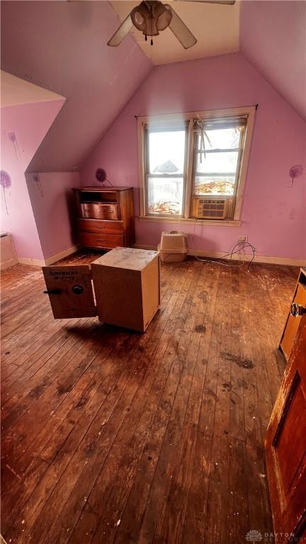 bonus room with vaulted ceiling, cooling unit, a ceiling fan, and dark wood-style floors