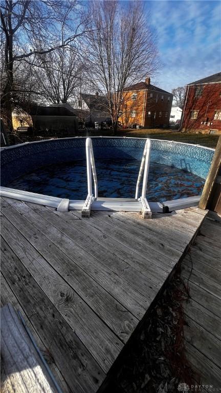 view of swimming pool with a wooden deck