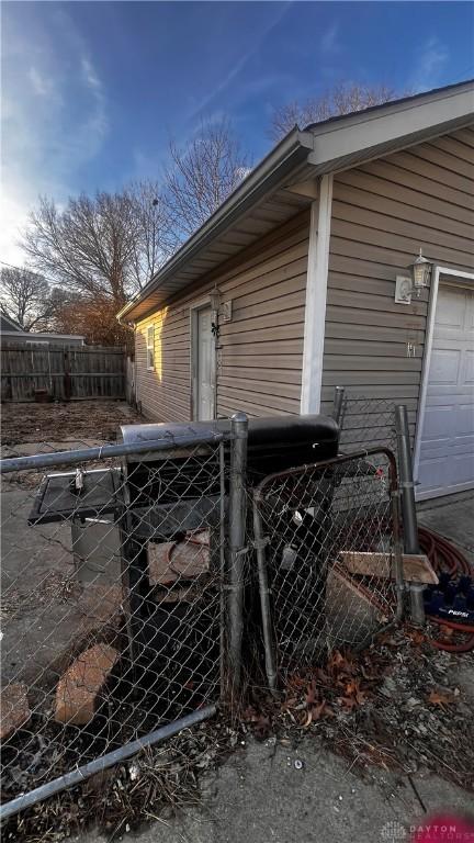 view of home's exterior featuring fence