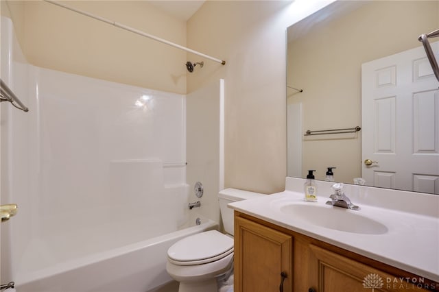 bathroom featuring toilet, vanity, and washtub / shower combination