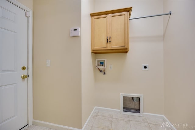 laundry room featuring electric dryer hookup, baseboards, cabinet space, and washer hookup