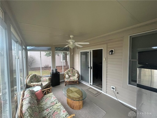 sunroom / solarium featuring ceiling fan