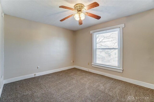 252 Illinois Ave, Dayton, OH 45410 - spare room featuring carpet floors, baseboards, and a ceiling fan