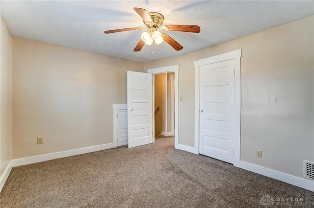 252 Illinois Ave, Dayton, OH 45410 - unfurnished bedroom with carpet floors, baseboards, and a ceiling fan
