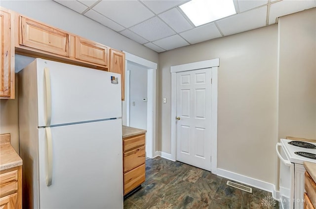 252 Illinois Ave, Dayton, OH 45410 - kitchen featuring white appliances, light brown cabinets, light countertops, baseboards, and a drop ceiling
