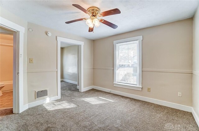 252 Illinois Ave, Dayton, OH 45410 - unfurnished bedroom with carpet flooring, baseboards, and ceiling fan