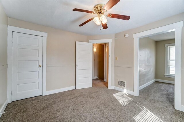 252 Illinois Ave, Dayton, OH 45410 - unfurnished bedroom with carpet flooring, baseboards, and ceiling fan