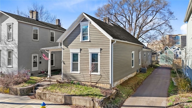 331 Morton Ave, Dayton, OH 45410 - view of front of house with central air condition unit and a chimney