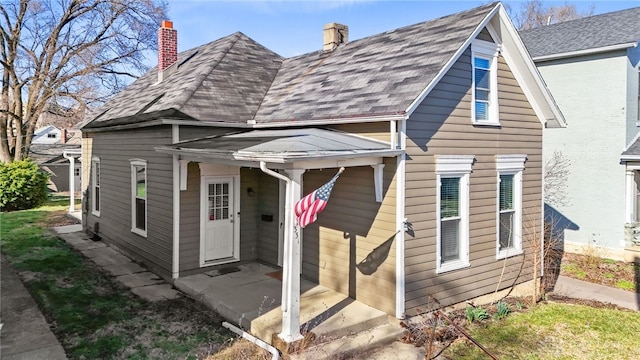 331 Morton Ave, Dayton, OH 45410 - view of front of house with a chimney and a shingled roof