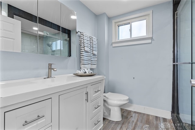331 Morton Ave, Dayton, OH 45410 - full bath featuring vanity, baseboards, an enclosed shower, toilet, and wood finished floors