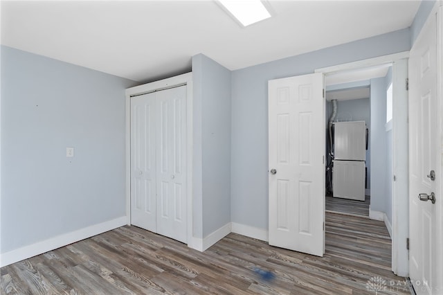 331 Morton Ave, Dayton, OH 45410 - unfurnished bedroom with fridge, wood finished floors, and a closet