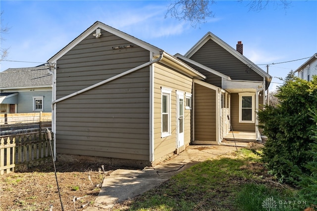 331 Morton Ave, Dayton, OH 45410 - rear view of property with a chimney and fence